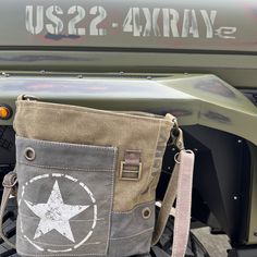 Repurposed Military Canvas US ARMY Sustainable Canvas Crossbody bag Upcycled crafted from Military Tent Canvas! Note* Colors are 2 different colors of green. Colors may differ depending on your screen/monitor. US Army Crossbody is Strong, Proud and Patriotic. Upcycled, from re-purposed military canvas it's the perfect size, durable and ready to report for duty! Army Strong. Perfect for Army Veteran, Wife - Army Mom - or a Patriotic Peep that loves a unique bag! Dimensions - 11" x 10" 11" x 10" < Military Style Shoulder Bag For Everyday Use, Military Style Khaki Rectangular Shoulder Bag, Military Style Khaki Satchel Shoulder Bag, Khaki Military Style Satchel Shoulder Bag, Khaki Military Bag With Adjustable Strap, Military Style Khaki Bag With Adjustable Strap, Military Style Khaki Shoulder Bag, Military Style Khaki Bags For Everyday Use, Best Beach Bag