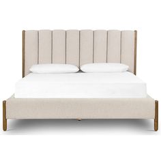 an upholstered bed with white linens and wood frame, in front of a white background