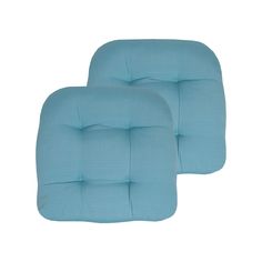 two blue square cushions sitting next to each other