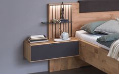 a bed with a wooden headboard and night stand