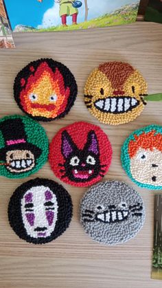 six beaded coasters with cartoon characters on them