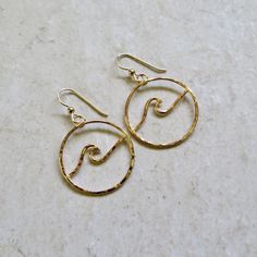 "Wave Hoop Earrings~ These circle wave hoops are handmade, hammered and polished for a beautiful shine. You are sure to get a lot of compliments while wearing these! *Choose sterling silver, 14k gold or rose gold fill from the drop down menu **Choose from sizes ~ SMALL approx. 1\" MEDIUM approx. 1.5\" LARGE approx. 2\" Model wearing similar design WAVE jewelry~ https://www.etsy.com/shop/hanamauicreations?search_query=wave+jewelry Shop~ https://www.etsy.com/shop/HanaMauiCreations?ref=hdr_shop_men Handmade Hoop Earrings For The Beach, Handmade Hoop Jewelry For The Beach, Beach Hoop Earrings Wire Wrapped, Beach Hoop Earrings With Wire Wrapping, Adjustable Hoop Earrings For Beach, Beach Wire Wrapped Hoop Earrings, Adjustable Hoop Earrings For The Beach, Circle Earrings With Ear Wire For Beach, Adjustable Small Hoop Earrings For Beach