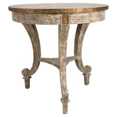 an old wooden table with two legs and a small round top on one end, against a white background