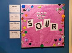 a bulletin board with the word sour written on it