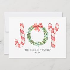 a christmas card with candy canes and the word joy on it