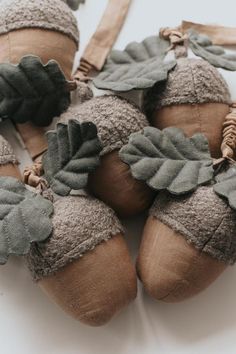 several baby shoes with leaves on them