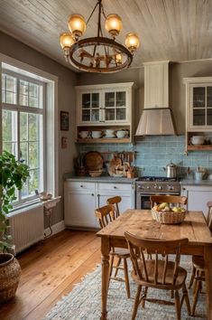 a kitchen with wooden floors and lots of counter space next to a dining room table