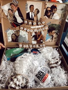 an open box filled with pictures and confetti