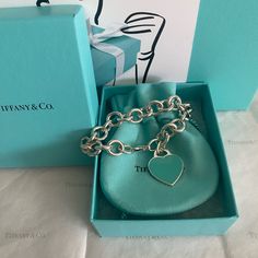 Authentic Sterling Silver And Tiffany Blue Enamel Tiffany Heart Tag Bracelet. This Retired Bracelet Is In New Condition With Possible Light Marks From Storing. Measures Approximately 6.5-7” So Definitely A Better Fit For Small Wrists. Will Include Box, Pouch, Ribbon, Gift Card And Small Gift Bag. No Tradesprice Firm Due To Selling Fees. Tiffany Prices Keep Going Up So Buying Now Is A Smart Investment. Values Keep Increasing Tiffany & Co, Tiffany And Co Heart Bracelet, Tiffany Heart Tag Bracelet, Tiffany Blue Heart Bracelet, Tiffany Lock Bangle, Sterling Silver Bangle Bracelets Tiffany & Co., Heart Tag, Small Gift Bags, Tiffany Blue