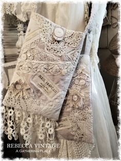 a white dress with lace and buttons on it