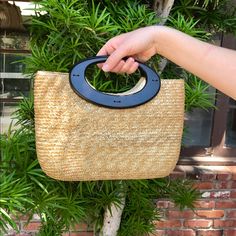 Small Straw Bag With Wood Handle. Chic Straw Tote Bag With Single Handle, Chic Summer Bag With Single Handle, Handheld Bags In Natural Color For Day Out, Everyday Handheld Beach Bag With Detachable Handle, Handheld Natural Color Bag For Day Out, Natural Handheld Bag For Day Out, Summer Bags With Round Leather Handles, Chic Handheld Beach Bag For Everyday Use, Natural Color Handheld Bag For Day Out