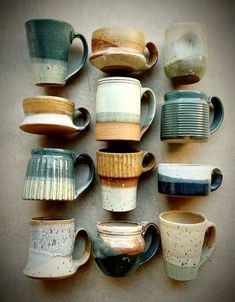 a collection of coffee cups sitting on top of each other in different shapes and sizes