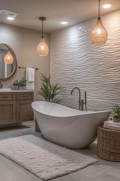 a bathroom with a large white bathtub sitting on top of a rug next to a sink