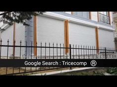 the google search is displayed in front of a building with an iron fence around it