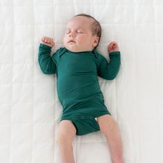 Our bamboo bodysuits are an essential piece for every mini wardrobe. Silky smooth and perfectly stretchy, these bodysuits work as both a standalone outfit or coordinating piece with any other Kyte Baby product. 97% Bamboo Rayon, 3% Spandex Breathable material Designed for sensitive skin Snap closures Fold over cuffs to prevent scratching on sizes preemie, newborn and 0-3 months Available in preemie size to fit babies 4-7 lbs Fitted Long Sleeve Onesie For Playtime, Long Sleeve Green Sleepwear For Playwear, Cotton Long Sleeve Onesie For Sleep, Fitted Long Sleeve Bodysuit For Playtime, Solid Long Sleeve Onesie For Playwear, Solid Color Long Sleeve Onesie For Playwear, Long Sleeve Green Onesie For Playwear, Long Sleeve Bodysuit For Playtime, Green Long Sleeve Onesie For Playwear