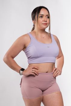 Introducing the dreamy Ethereal Collection, designed for empowered women who are a work in progress! This size inclusive lavender longline bra features a flattering cross strap back, reflective logos, removable pads, and buttery soft lining. Low to medium impact, this comfortable sports bra is great for light to regular workouts, yoga sessions, and everyday wear. Make it an ethereal dream and pair it with our Ethereal Women's Highwaisted Compression Shorts for the perfect blend of style, comfort Intelligent Clothes, Workouts Yoga, Chevron Top, Long Blond, Longline Bra, Long Black Hair, A Work In Progress, Compression Shorts, Long Blonde Hair