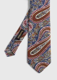 Our neckties are made from the finest fabrics in the world and feature intricate paisleys, florals and vintage prints. This allover summer paisley print linen and silk blend tie adds a subtle hint of color and pattern to your look.   Self Tipped Italian Printed Silk Blend Fabric Made in USA 9 cm. Paul Stuart is one of the oldest and most well respected names in fashion, offering exclusive and custom tailored clothing, sportswear, footwear and accessories for men and women. Renowned for expert cr Elegant Multicolor Paisley Print Suit And Tie Accessories, Elegant Multicolor Floral Print Suit And Tie Accessories, Elegant Patterned Tie With Floral Print, Multicolor Paisley Print Suit And Tie Accessories For Business, Elegant Multicolor Paisley Print Ties, Elegant Patterned Ties With Paisley Print, Elegant Patterned Summer Ties, Elegant Summer Patterned Ties, Classic Paisley Print Patterned Ties