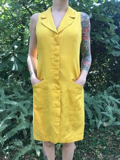 Vintage 60's Yellow Shift Style Dress Button Down Closure with Hidden Buttons Inside Lined in Silky Rayon (Nice in Warmer Climates for Cooling Effect) Condition: Vintage - Great (No Visible Markings/Holes) Brand: Sàke Size: Marked Size 10 - Would Suggest for a Modern S/M Measurements (Taken While Laying Flat): Bust: 18 1/2 Inches Waist: 17 Inches Hips: Free Retro V-neck Dress With Buttons, Mod Sleeveless Dresses With Buttons, Vintage Button-up Mini Dress, Vintage Button-up Mini Dress For Summer, Retro Sleeveless Vintage Dress With Buttons, Sleeveless Retro Vintage Dress With Buttons, Vintage Dress With Button Closure For Vintage Fashion, Retro V-neck Dress With Button Closure, Retro Mini Dress With Button Closure For Spring