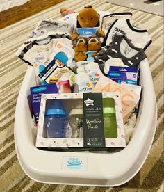 a baby's diaper tray full of items on the floor