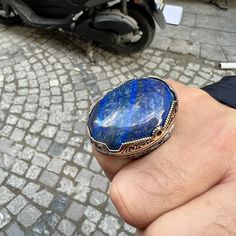 Silver Natural Large Lapis Lazuli Stone Ring , Blue Lapis Ring , Silver Handmade Large Ring , Ottoman Style Ring , 925k Sterling Silver Ring ★Item Details * Gender : Male / Female * Material : 925K Sterling Silver * Total weight :  52 Grams * Gemstone :  Lapis Lazuli Stone * Stone Size 30x40mm ✔ Ready to Ship in 1-2 Business Days .. ✔ Shipped to the Worldwide 1-5 business days with free shipping... ✔ The product will be sent to you with a handmade wooden box to avoid any damage during shipping.. Blue Lapis Lazuli Rings With Gemstone, Blue Lapis Lazuli Gemstone Rings, Handmade Blue Sapphire Open Ring, Blue Natural Stone Crystal Ring In Sterling Silver, Handmade Blue Crystal Ring In Sterling Silver, Blue Sterling Silver Crystal Ring With Natural Stones, Artisan Blue Ring Stamped 925, Spiritual Blue Crystal Ring In Sterling Silver, Spiritual Blue Sterling Silver Crystal Ring