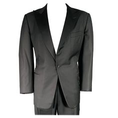 ERMENEGILDO ZEGNA tuxedo in a black wool with a full liner and includes a single breasted, single button sport coat with a peak lapel and matching pleated trousers. Made in Switzerland. Note: sleeves are slightly uneven, please check measurements.Very Good Pre-Owned Condition. Marked: 56 Measurements: -JacketShoulder: 19 inches Chest: 46 inches Left Sleeve: 25 inches Right Sleeve: 25.5 inches Length: 31.5 inches -PantsWaist: 36 inches Rise: 11 inches Inseam: 30 inches Sui Generis Reference: 1298 Formal Black Outerwear With Pressed Crease, Black Winter Tuxedo For Formal Occasions, Classic Black Tuxedo With Lapel Collar, Winter Black Tuxedo With Pressed Crease, Luxury Single Breasted Outerwear For Black Tie, Bespoke Black Business Blazer, Luxury Single-breasted Outerwear For Black Tie, Black Tuxedo With Pressed Crease And Long Sleeves, Black Tuxedo With Pressed Crease