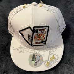 Silver And Gold Embroidered Dice On Cap. Ace King Poker Hands On The Front And On The Back. Pitbull Brand. Get Lucky On Your Next Poker, Blackjack, Or Casino Trip!!! White Snapback Fitted Hat, White Hip Hop Trucker Hat With Flat Bill, Embroidered White Baseball Cap For Streetwear, White Embroidered Baseball Cap For Streetwear, White Adjustable Fitted Hat For Hip Hop, Fitted Embroidered White Hat, White Embroidered Fitted Hat, White Hip Hop Baseball Cap, One Size Fits Most, White Hip Hop Fitted Baseball Cap