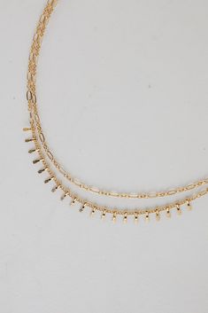 Gold Layered Chain Necklace Gold Plated Double Chain Choker, Gold Plated Double Chain Choker Necklace, Double Strand Metal Necklace With Delicate Chain, Dainty Gold Multi-strand Layered Necklace, Dainty Gold Layered Charm Necklaces, Gold Layered Charm Necklace Choker, Gold-tone Multi-strand Adjustable Layered Necklace, Minimalist Multi-strand Gold Chain Layered Necklace, Gold-tone Multi-strand Layered Necklace