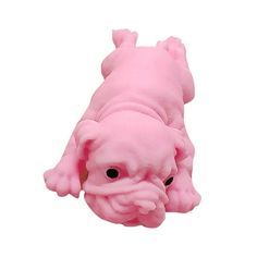 a pink stuffed animal laying on its side