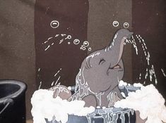 an elephant in a bathtub with bubbles coming out of it