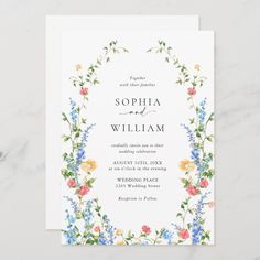 a wedding card with watercolor flowers on it