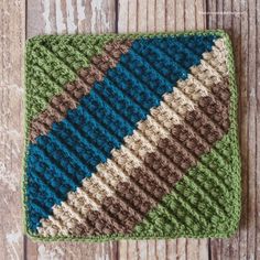 a crocheted dishcloth on a wooden surface