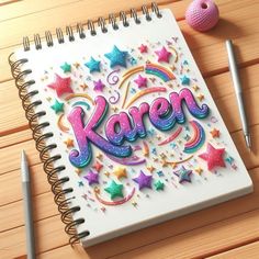 a spiral notebook with the word karem written on it next to a ballpoint pen