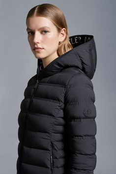 Refined and minimalistic, the Alete down jacket is emblematic of the Matt Black collection. Crafted from stretch nylon, the short puffer is enhanced with ripstop lining and a hood. Graphic logo lettering adds the finishing touch. Sporty Nylon Puffer Jacket With Double-lined Hood, Sporty Nylon Hooded Jacket With Padded Collar, Down Jackets, Graphic Logo, Letter Logo, Down Jacket, Puffer, Jackets For Women, For Women