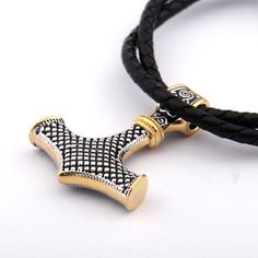 Embrace the power of Thor with our Viking necklace featuring Mjolnir. Crafted from premium 925 sterling silver with gold-colored trim, this pendant is a symbol of strength and protection. Product details: Material: 925 Sterling Silver Stainless steel & leather chain included. Item Weight: 27.1g Pendant Size: 32*40*8mm Free wooden gift box and jewelry bag included Free worldwide shipping Mjolnir Pendant, Viking Culture, Viking Pendant, Viking Necklace, Jewelry Bag, Leather Chain, Jewelry Bags, Gold Trim, Thor