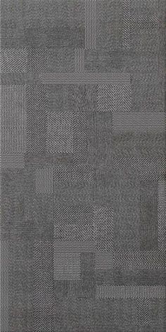 a gray rug with squares on it