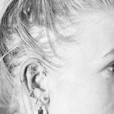 a woman with ear piercings on her ears