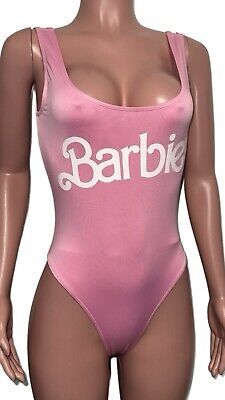 a mannequin wearing a pink bathing suit with the word barbie written on it