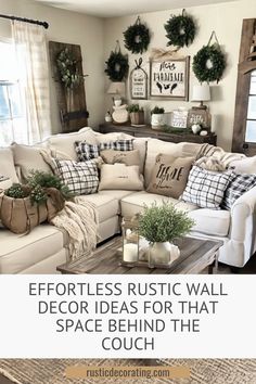 a living room with white couches and christmas wreaths on the wall above them