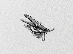 an eye drawn on top of a piece of paper