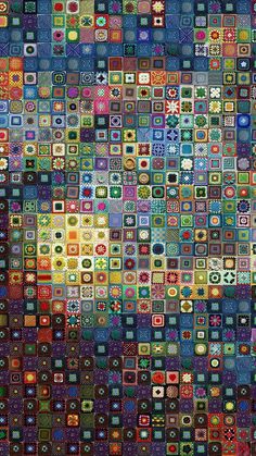 an image of a colorful pattern made up of many different squares and circles, all in various colors