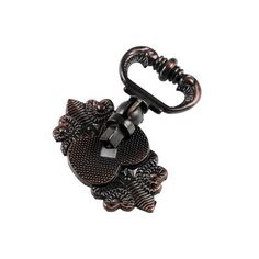 a black and brown keychain with an ornate design on the front, hanging from it's side