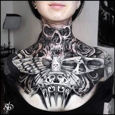 a woman with black and white tattoos on her chest