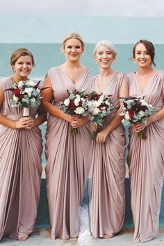 the bridesmaids are all wearing different styles of dresses