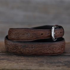 A beautiful belt that subtly combines western tooling with an oiled American Bison pull-up leather. Normally this type of oiled leather is only found with a completely smooth surface, but our master leather craftsmen are able to delicately carve our running oak leaf pattern into each. The resulting look gives it a warm, distressed vibe. Each belt is fully hand tooled and made of genuine American Bison. Like all belts our tooled bison is lined in top grain leather and accented with fine stitched Oak Leaf Pattern, Leaf Belt, Dr Closet, American Bison, Leather Craftsmen, Beautiful Belts, Western Belts, Oak Leaf, Sterling Silver Mens