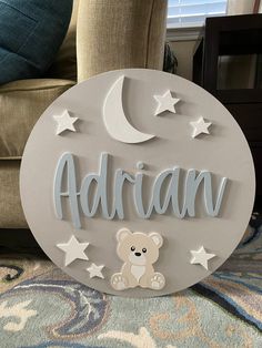 a wooden sign with a teddy bear and the word'adran'on it