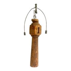 an old fashioned wooden wind chime on a white background with clippings to the top