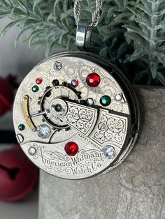 "Beautiful antique American Waltham Watch Co. pocket watch pendant with red, green and clear crystals.  I love the scroll work engraved on these old watches. Perfect for Christmas or anytime of year. Purchase with or without the pictured 24\" .925 Italy Sterling Silver Singapore Chain." Waltham Watch, Watch Pendant, Steampunk Pendant, Pocket Watch Necklace, Christmas Necklace, Scroll Work, Old Watches, Clear Crystals, Watch Movement