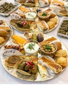 a table topped with plates filled with different types of food