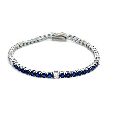 Introducing our stunning Silver Tennis Bracelet, meticulously crafted in Italy and plated with radiant rhodium. This bracelet is a true symbol of elegance and sophistication, blending classic design with modern flair. Each link of the bracelet features mesmerizing blue round-cut stones alternating with dazzling white princess-cut stones. The harmonious combination of these exquisite gems creates a striking contrast that captivates the eye and adds a touch of luxury to any ensemble. Crafted with Luxury Blue Tennis Bracelet For Wedding, Modern Brilliant Cut Tennis Bracelet As Gift, Modern Tennis Bracelet With Brilliant Cut For Gift, Modern Brilliant Cut Tennis Bracelet, Modern Sterling Silver Cubic Zirconia Bracelet Gift, Modern Brilliant Cut Bracelets For Gifts, Modern Brilliant Cut Bracelets As Gift, Modern Bracelets With Brilliant Cut As A Gift, Modern Polished Tennis Bracelet As Gift