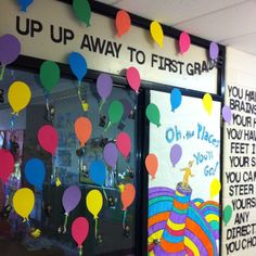 there are many balloons hanging in the window for children to use on their school day